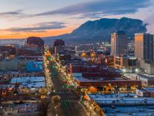aerial view of downtown colorado springs at night. mountains in the background